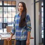 her designs are as cool as she is portrait of a young female designer in a modern office